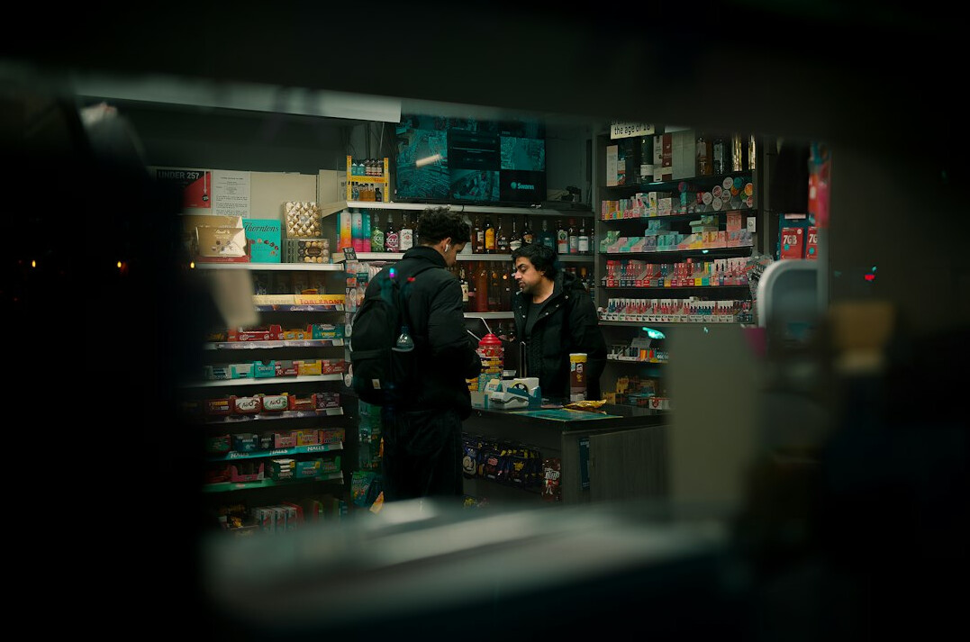 store detective watching thief